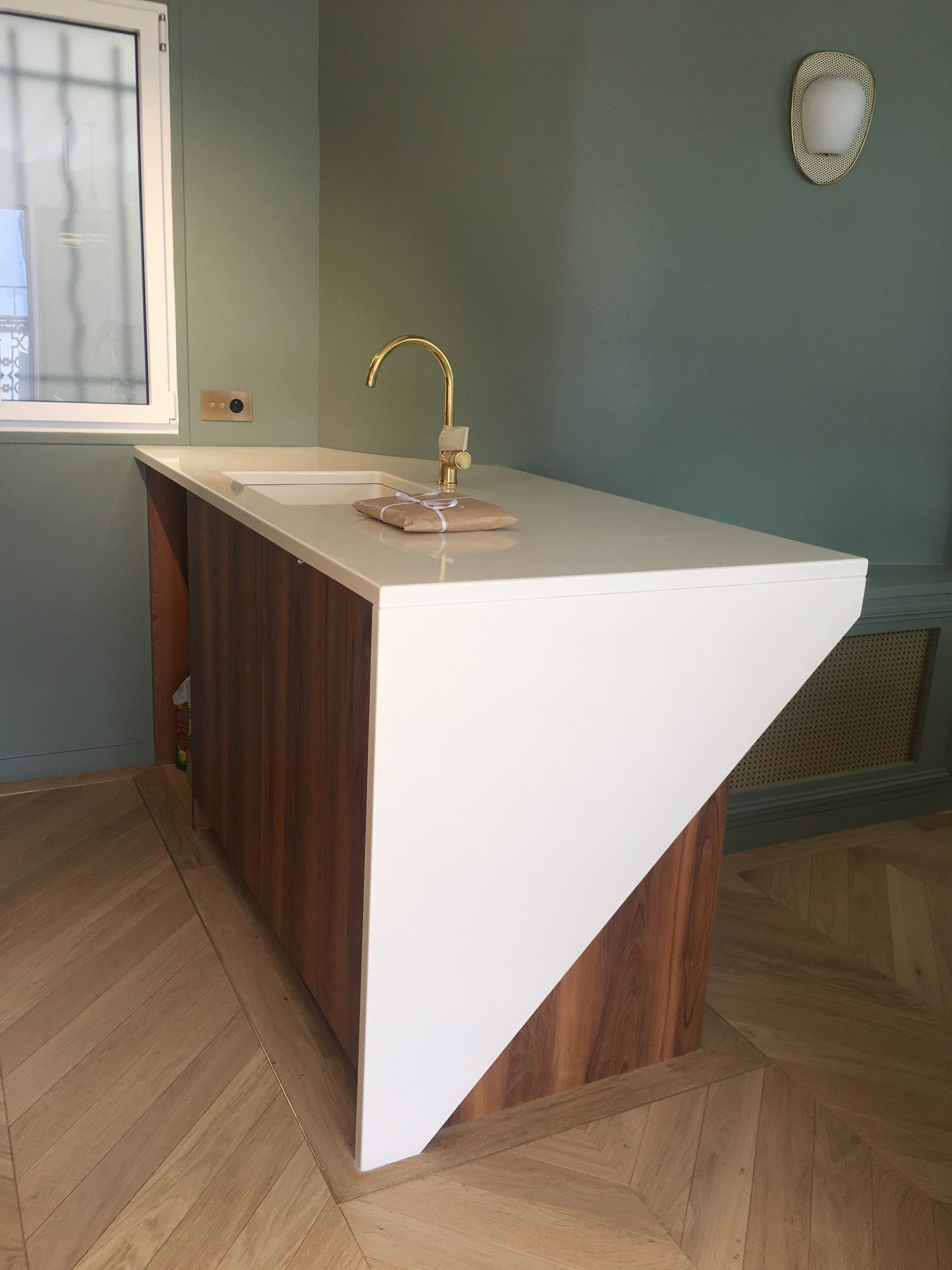 Enamelled lava stone kitchen worktop central island and washbasin in a parisian flat