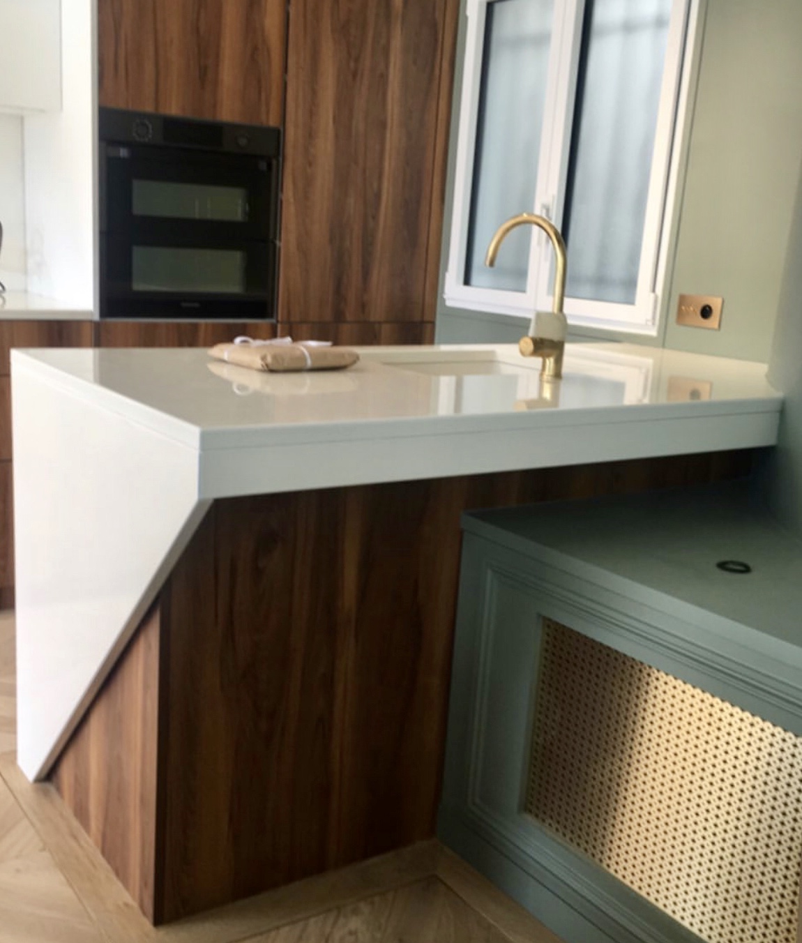 Enamelled lava stone kitchen worktop central island and washbasin in a parisian flat